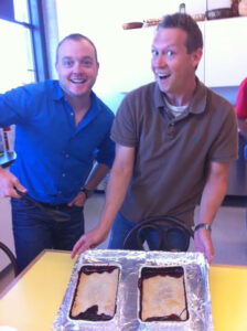 Image of Senior Creative Director Josh Keown and Editor in Chief Jeremy White in the test kitchen at Pizza Today HQ.