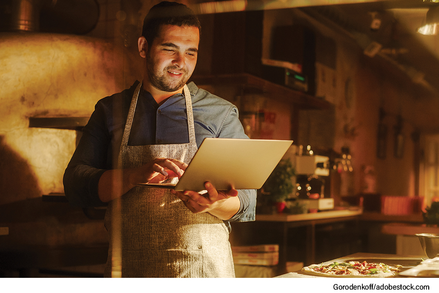 Email Marketing in 2024, pizzeria owner on laptop