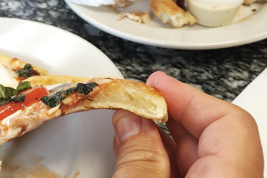 avoid undercooked pizza, gum line, pizza slice